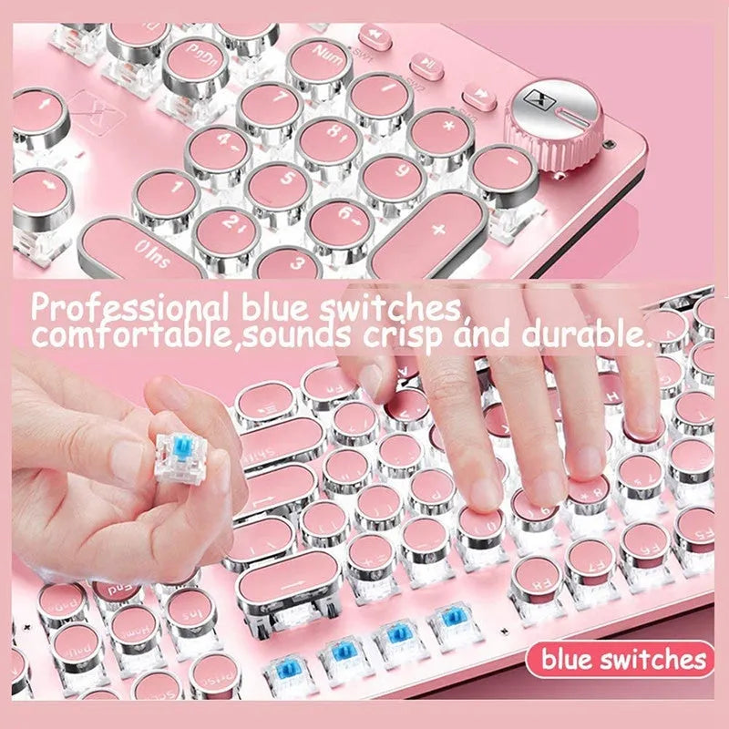 Queen Lipstick mechanical keyboard with green switches, white backlight, silver and pink casing on a desk.