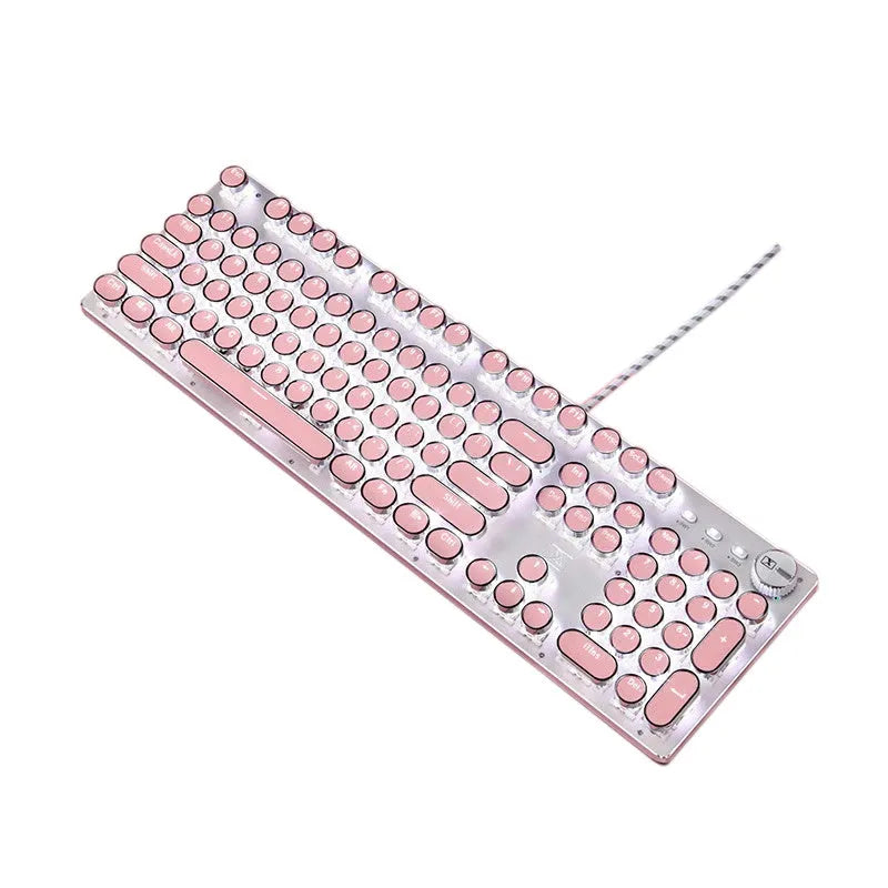 Queen Lipstick mechanical keyboard with green switches, white backlight, silver and pink casing on a desk.