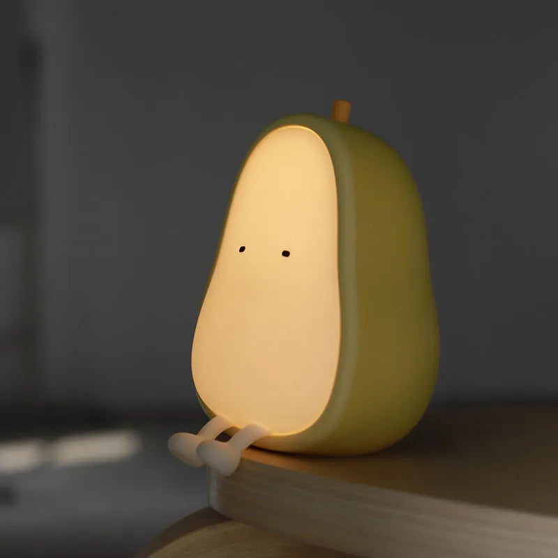 Warm yellow silicone PEAR night lamp with USB charging port and ABS base