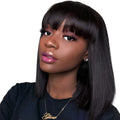 A Black human hair wig with short to medium length on an adjustable 10-inch wig cap.