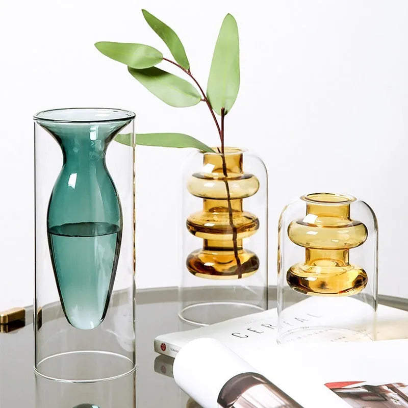 Small colourful double layer blown glass vase for dried flowers, yellow colour option on a table