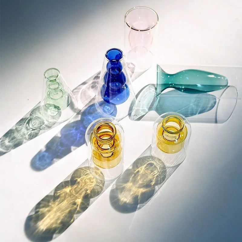 Small colourful double layer blown glass vase for dried flowers, yellow colour option on a table
