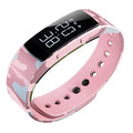 Digital sports watch with black dial, luminous display, and silicone strap showing 30m water resistance