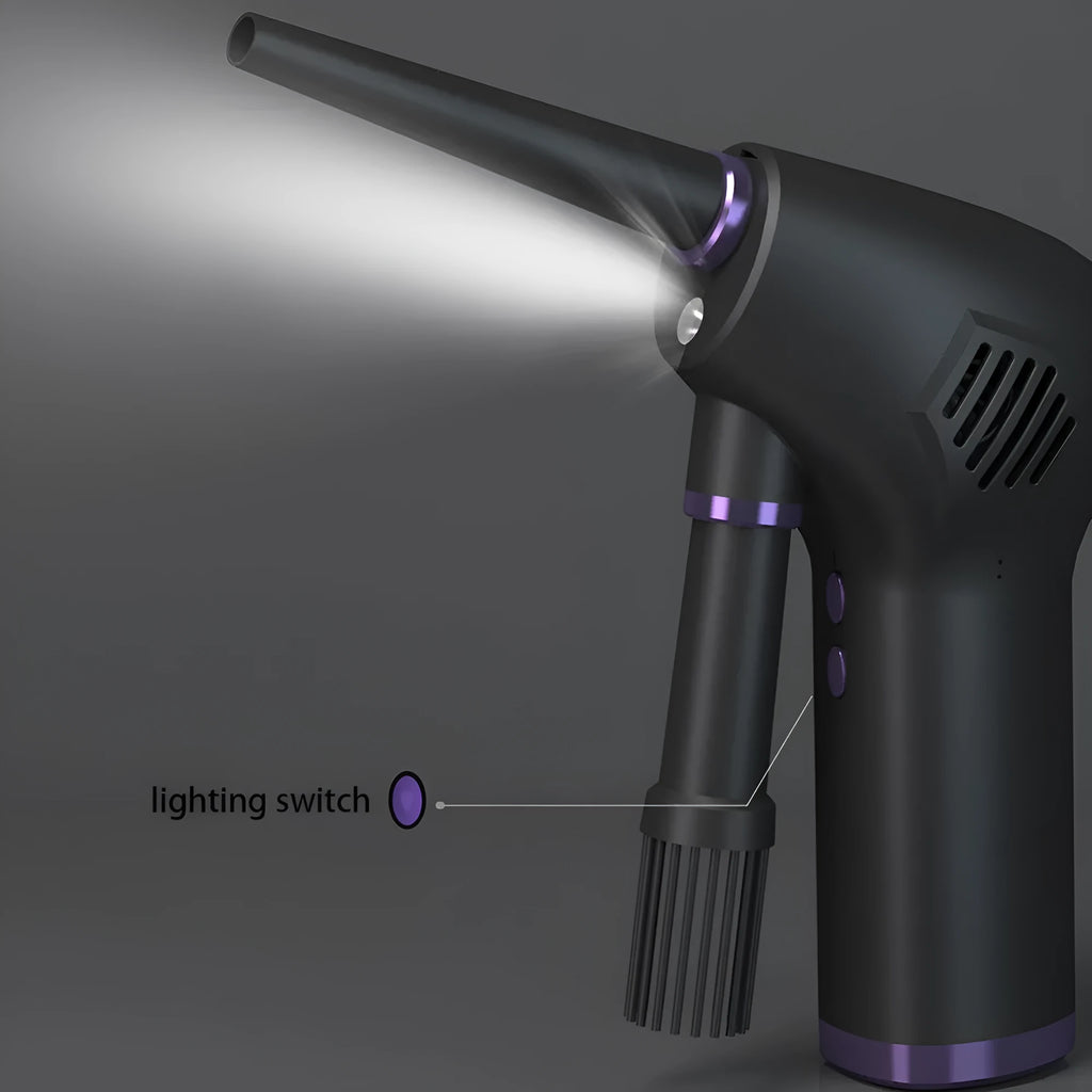 Black cordless air duster with full-palm grip and withdrawable nozzle for computer and camera cleaning
