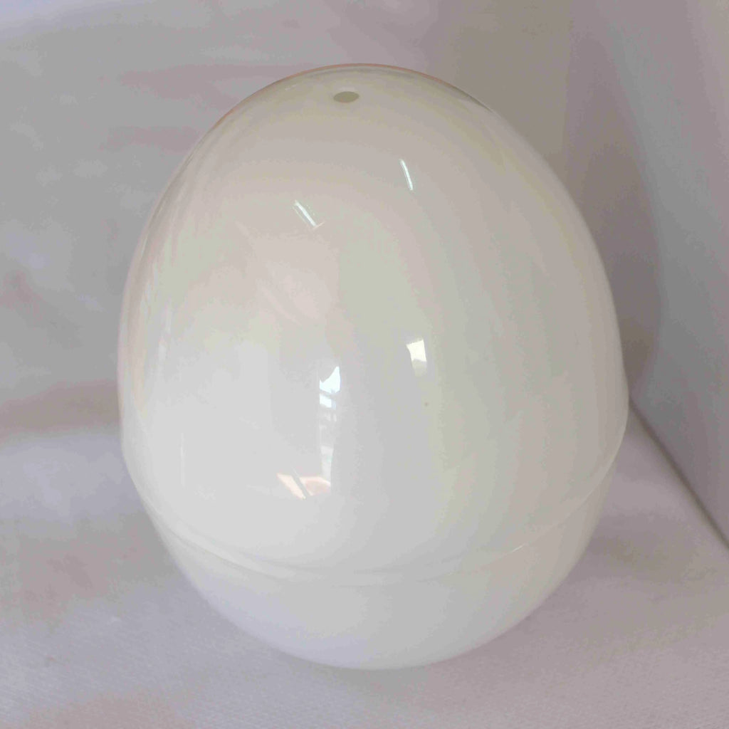 White plastic microwave egg cooker with aluminium inner layer for 1-4 eggs.