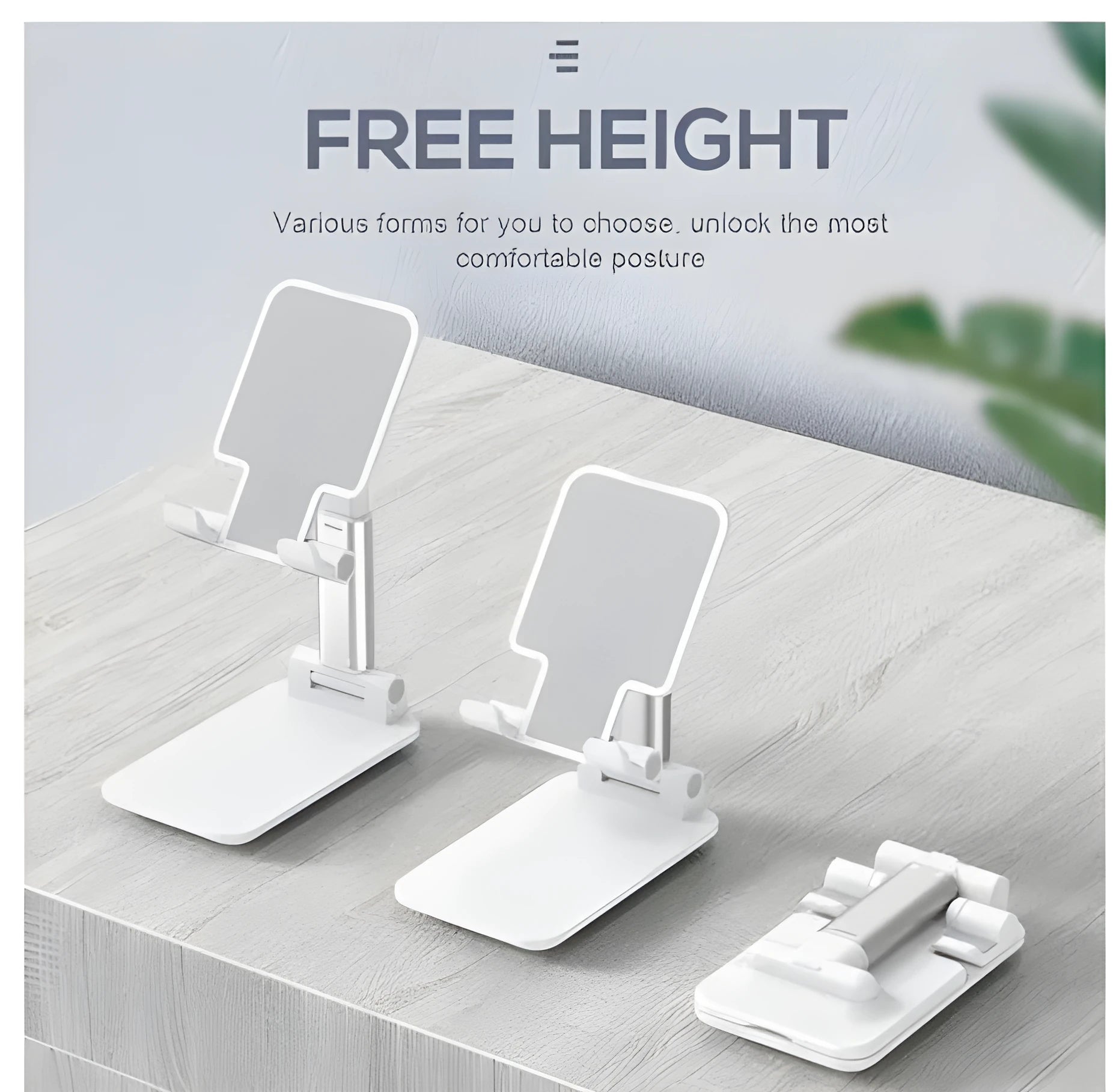 Black, white, green, and pink silicone and ABS plastic desk mobile phone holder on a wooden table.