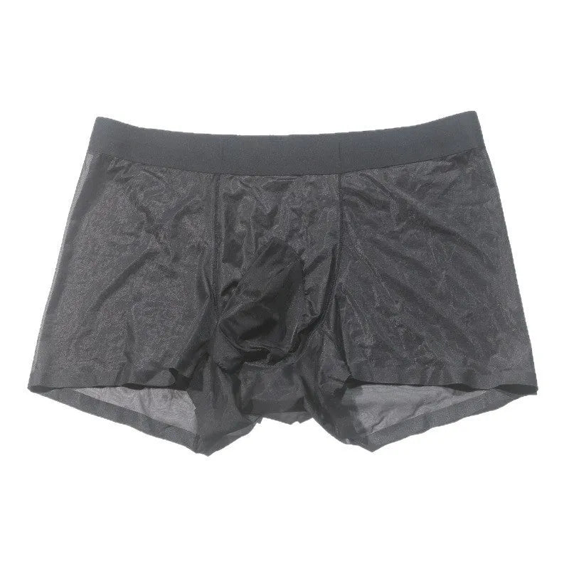 Men's plus size ice silk transparent seamless shorts in skin colour on a grey background