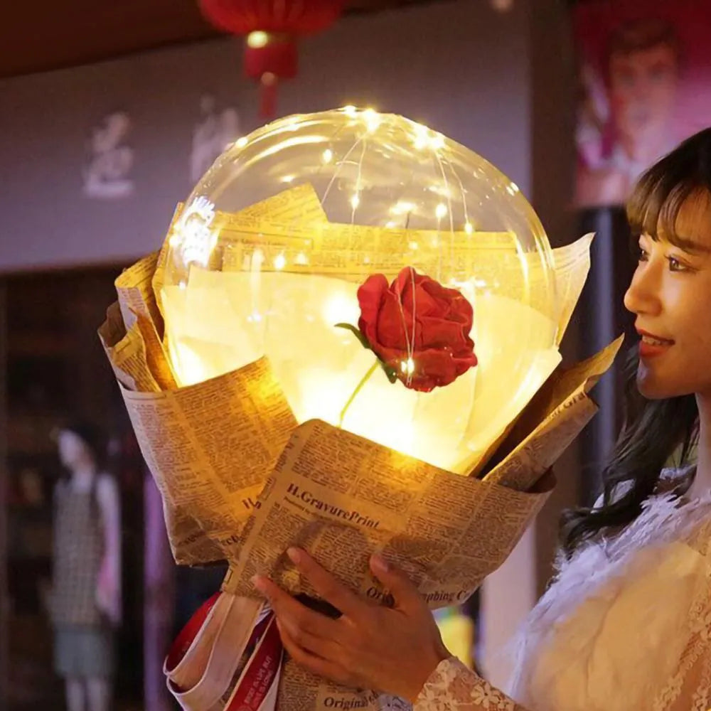 DIY LED luminous transparent balloon rose bouquet kit with artificial flowers and lights for assembly.