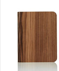 Solid wood USB-powered book light in three sizes on a desk with a book.