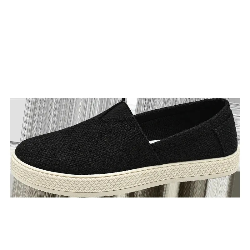 Men's beige canvas slip-on shoes with round toe and PVC sole.