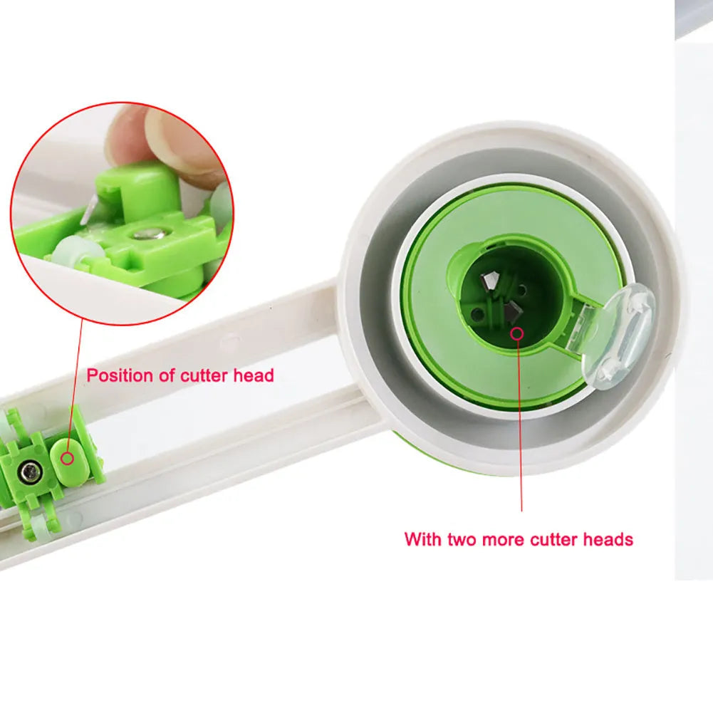 Green plastic round rotary paper cutter on a desk next to an A3 sheet of paper.