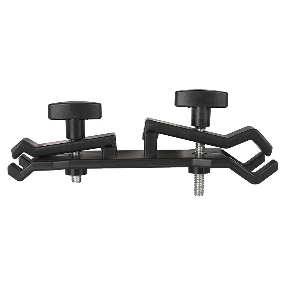 Black ABS plastic umbrella clip mounted on a camera tripod head.