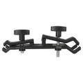 Black ABS plastic umbrella clip mounted on a camera tripod head.