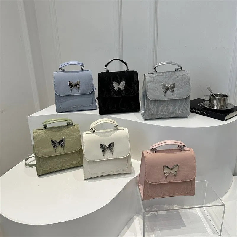 Women's PU leather backpack in multiple colours with bow detailing and hand-carrying option