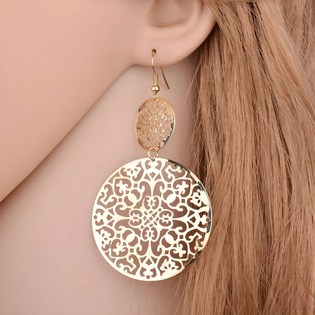 Women's gold round hollow dangle earrings made from zinc alloy, 4.5 by 8 cm, one pair