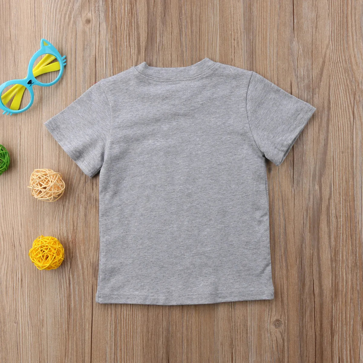 Grey cotton t-shirt for a child with a print, shown in sibling-themed colour variations.