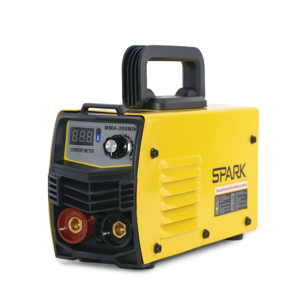Household MMA-200MIN 220V DC inverter welding machine with cables, tongs, clamp, and face shield on a workbench.