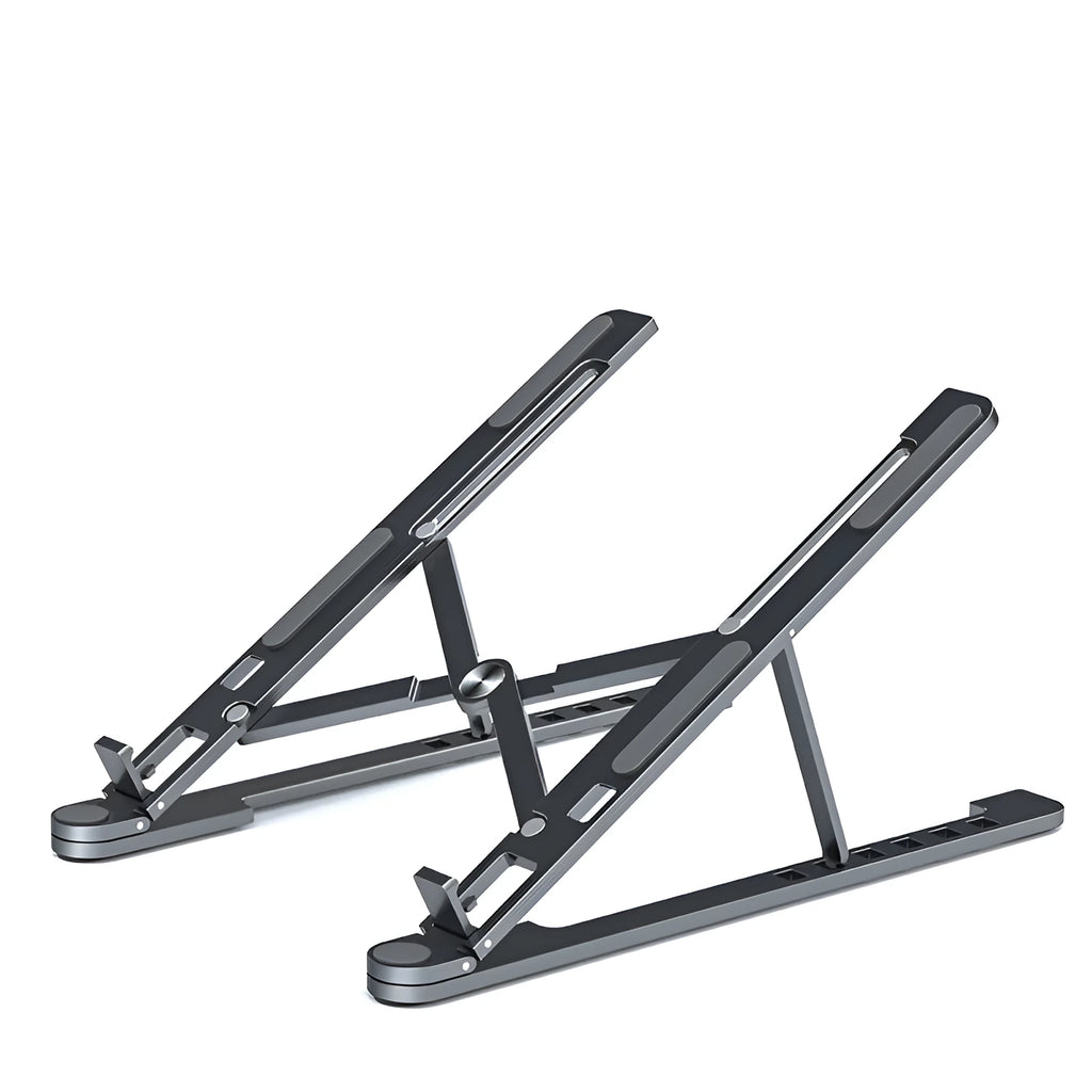 Silver foldable aluminium laptop stand holding a MacBook at an adjusted angle