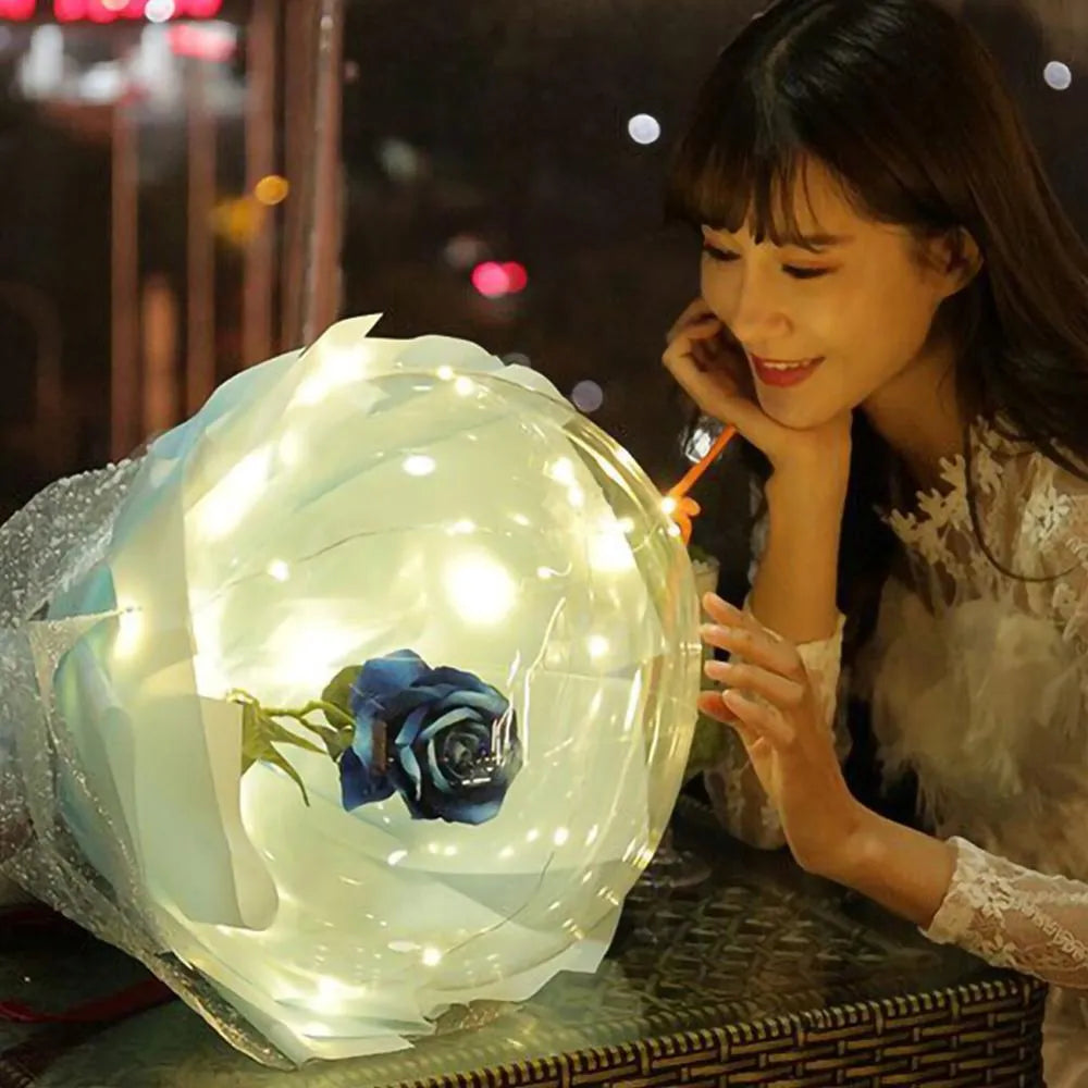 DIY LED luminous transparent balloon rose bouquet kit with artificial flowers and lights for assembly.