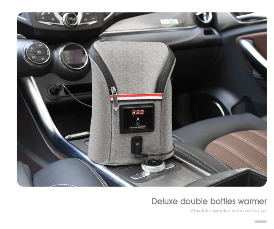 Grey Oxford cloth car USB baby bottle warmer with electronic display, shown with two bottles and car charger.
