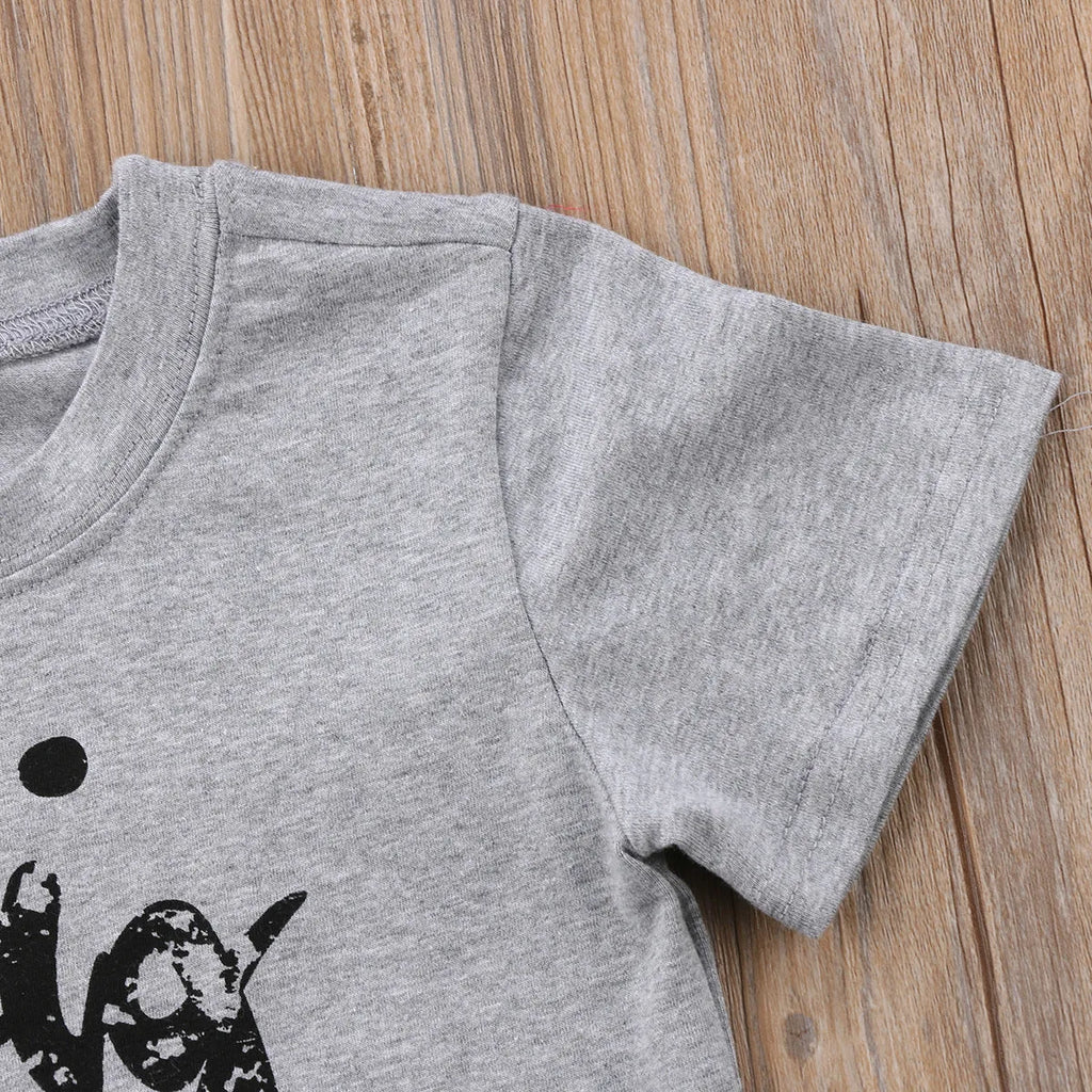 Grey cotton t-shirt for a child with a print, shown in sibling-themed colour variations.