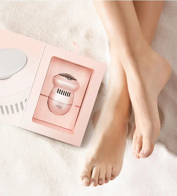 Beige electric foot file grinder with diamond grinding heads and USB charging cable