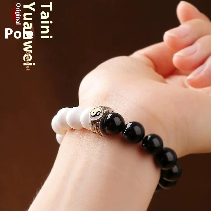 Black and white Tai Chi bracelet with obsidian beads and mantra charm