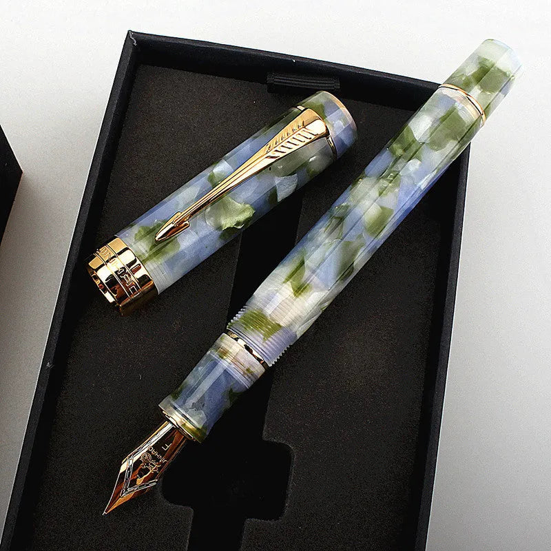 Deep bath green metal ballpoint pen with three interchangeable nib options shown