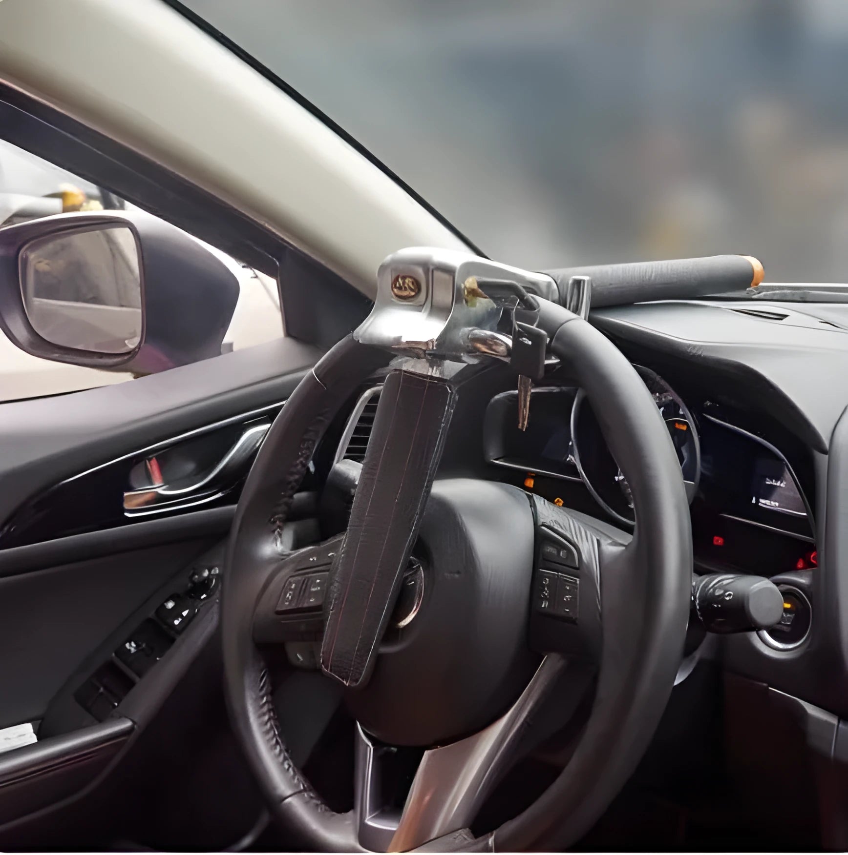 Black car steering wheel lock with alarm, alloy body and artificial leather handle, folded for storage