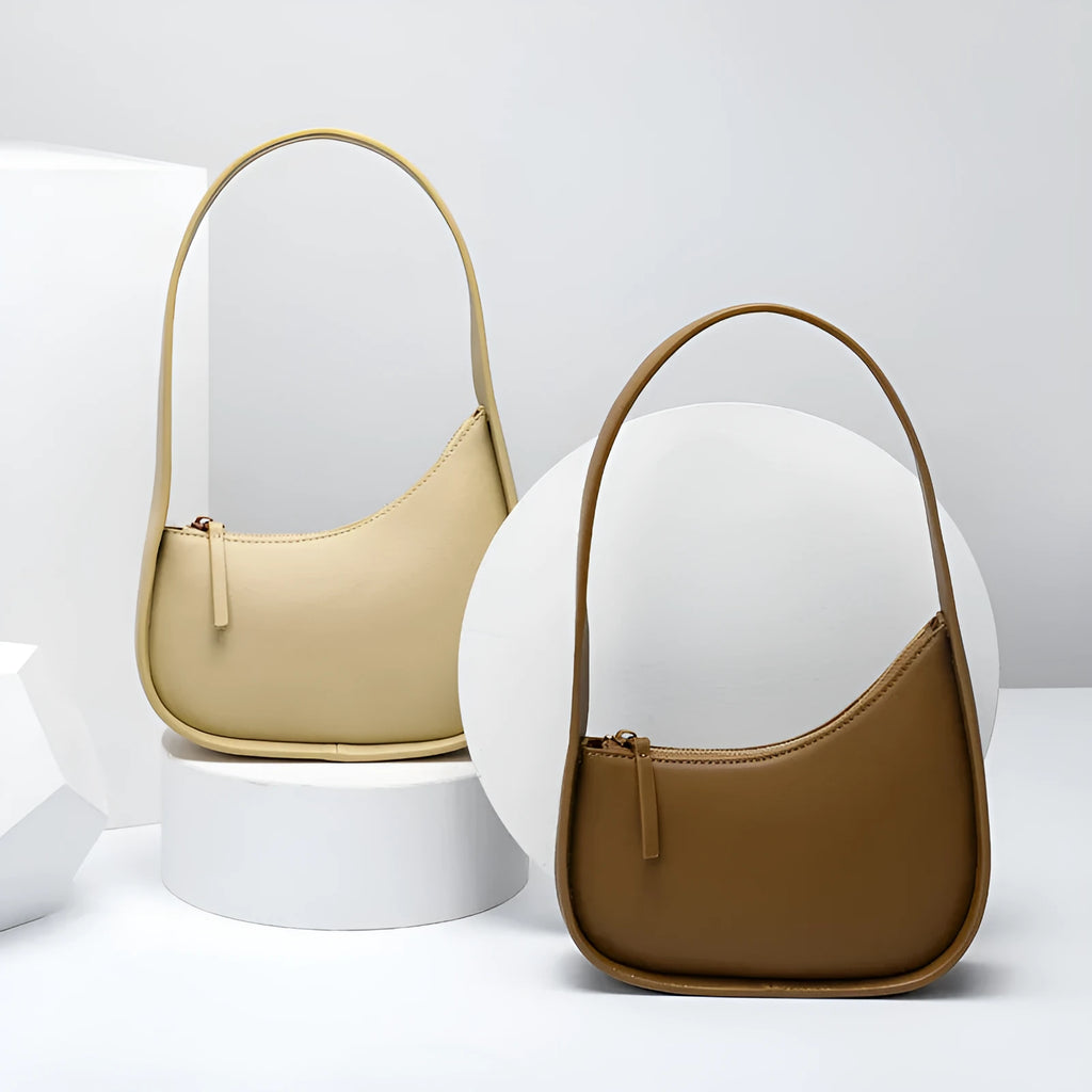 Small leather half moon shoulder bag with wide strap in four colour options
