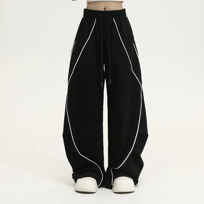 Black striped wide-leg hip hop sports pants with a mid waist and loose fit.