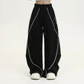 Black striped wide-leg hip hop sports pants with a mid waist and loose fit.