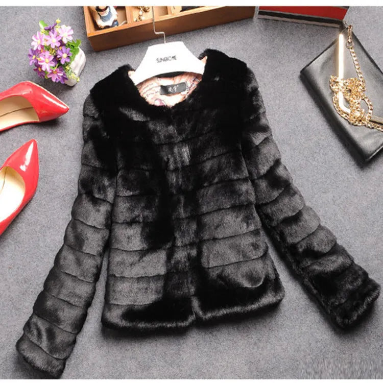 Women's short faux fur top in beige, black, or white with regular sleeves.