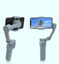 Folding three-axis mobile phone gimbal stabiliser shown in both unfolded and compact folded configurations