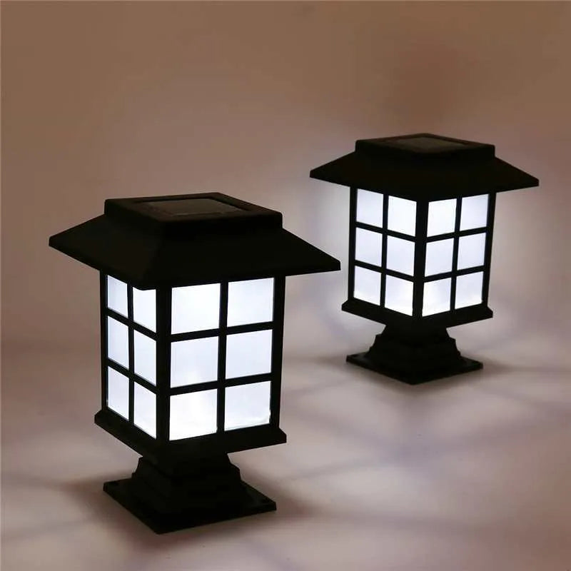 Black solar-powered LED lawn light for outdoor garden and pathway illumination.