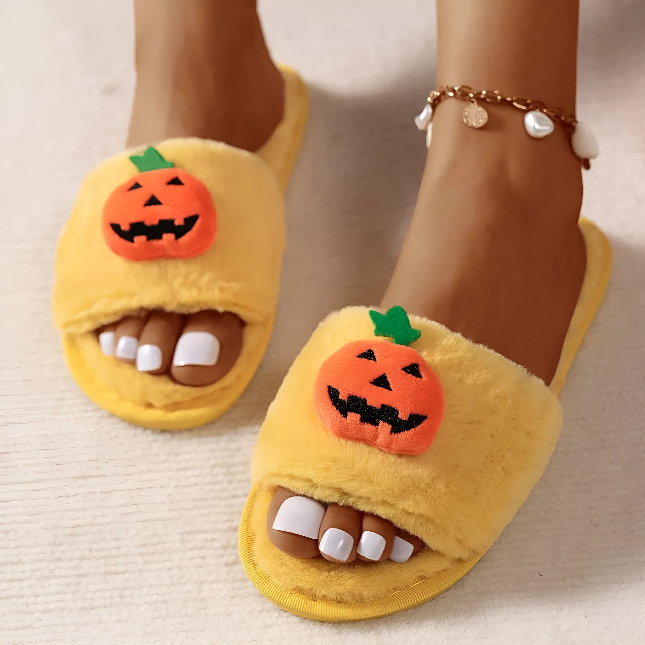 Open toe pumpkin plush slippers in synthetic fur with cartoon design and PVC soles