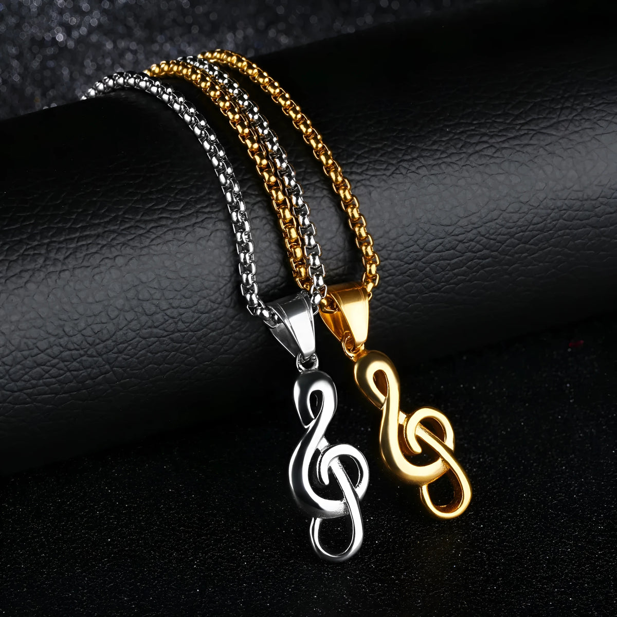 Titanium steel music symbol necklace in gold or silver colour, shown with and without chain