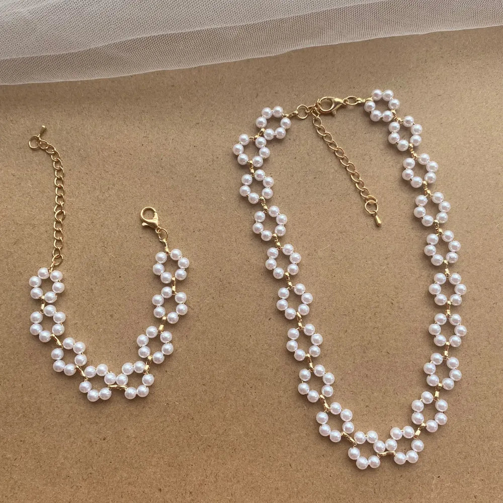 Pearl necklace and bracelet set for women on white background