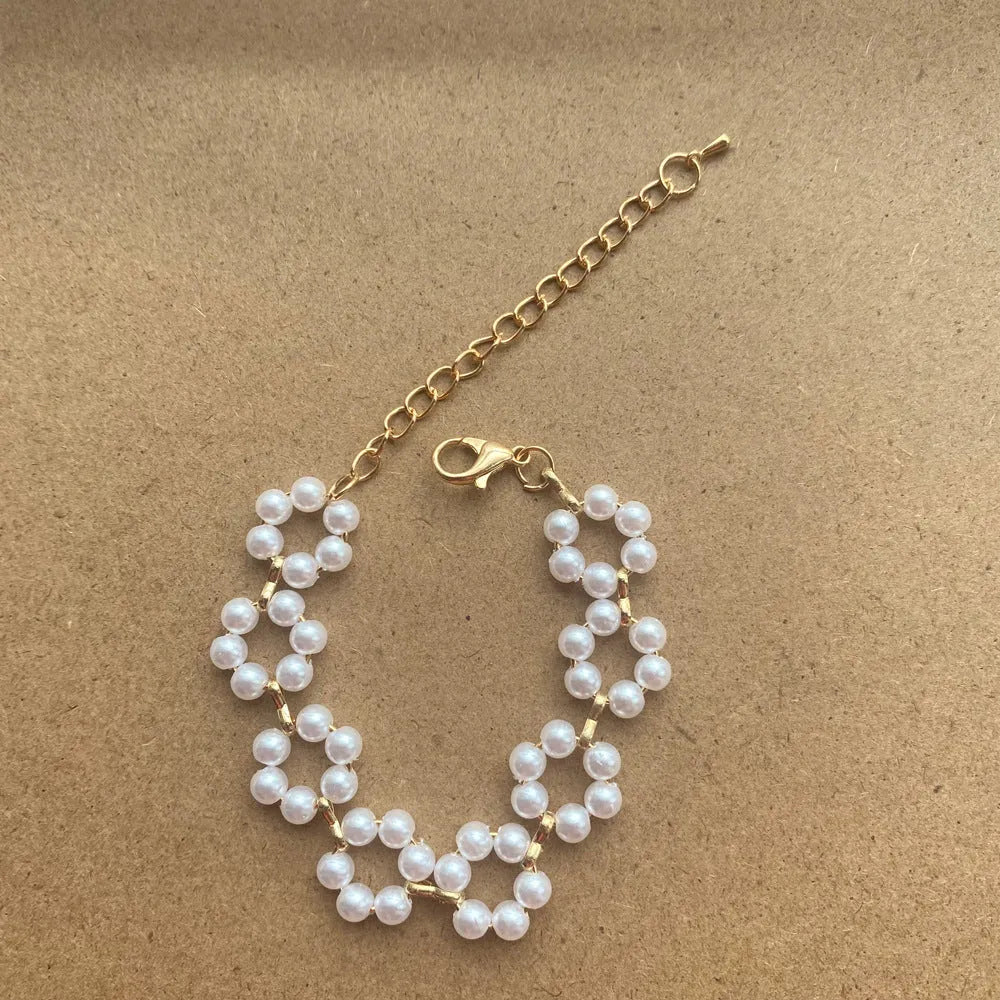 Pearl necklace and bracelet set for women on white background