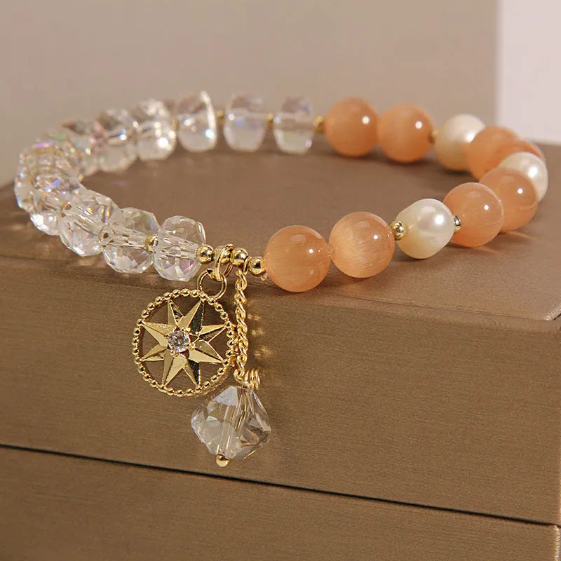 Orange Eight Awn Star bracelet with gold-plated setting and opal crystal inlay