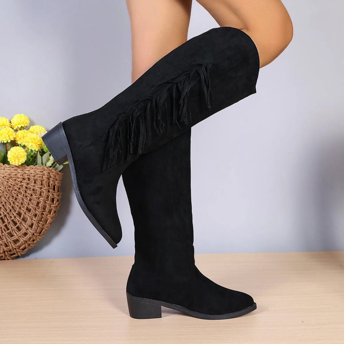 Women's brown fringe chunky heel long western boots with tassel detail and pointed toe