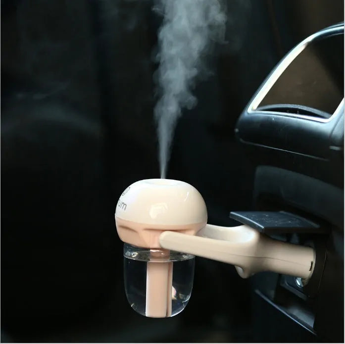 Compact blue car humidifier diffuser with mist output and rotation feature