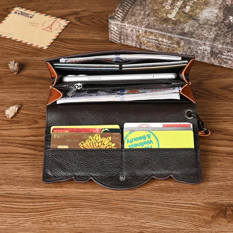 Retro brown tri-fold women's leather wallet with an embossed floral pattern, shown open to reveal compartments.