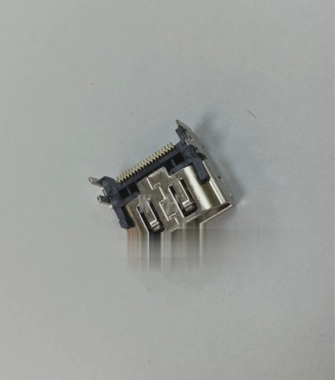 Silver-coloured HDMI interface host socket for games console accessories