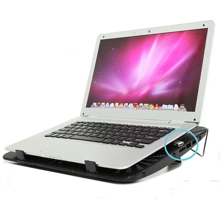 Black aluminium laptop cooling base with 140mm exhaust fan on a desk surface