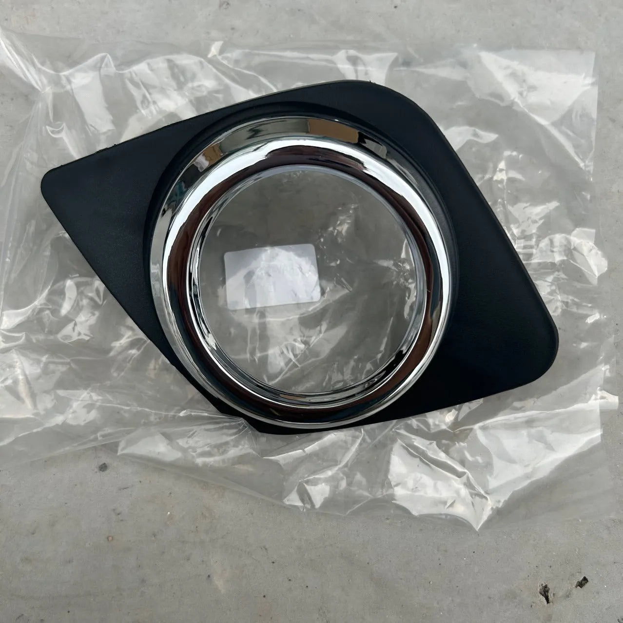 Black Toyota RAV4 front bumper anti-fog light cover for driver or passenger side