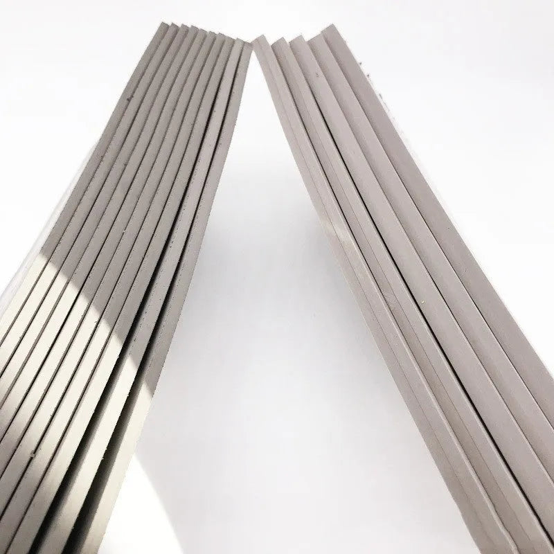 Black and grey plastic light-sensitive mat for calligraphy seals, showing 330mm by 110mm size.