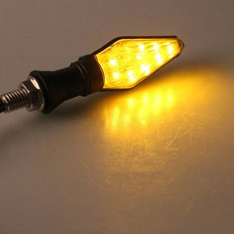 Motorcycle turn signal light with dual-colour yellow and blue LED illumination for direction indicators