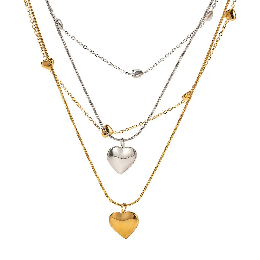 Love double-layer 18K gold-plated collarbone necklace with snake pendant for women on display