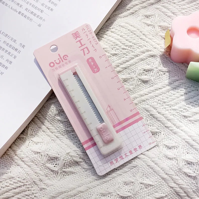 Small plastic blade art knife in blue, pink, purple, khaki or orange for cutting packages and paper